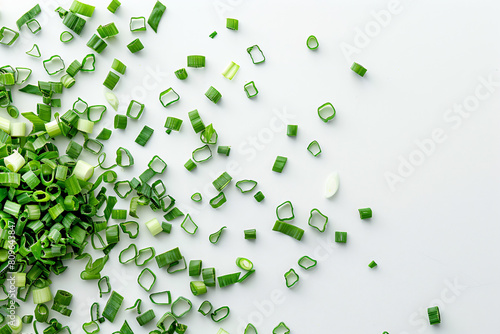 a pile of chopped green onions on a white surface