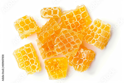 a pile of honeycombs on a white surface