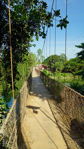 suspension bridge over river near battambang