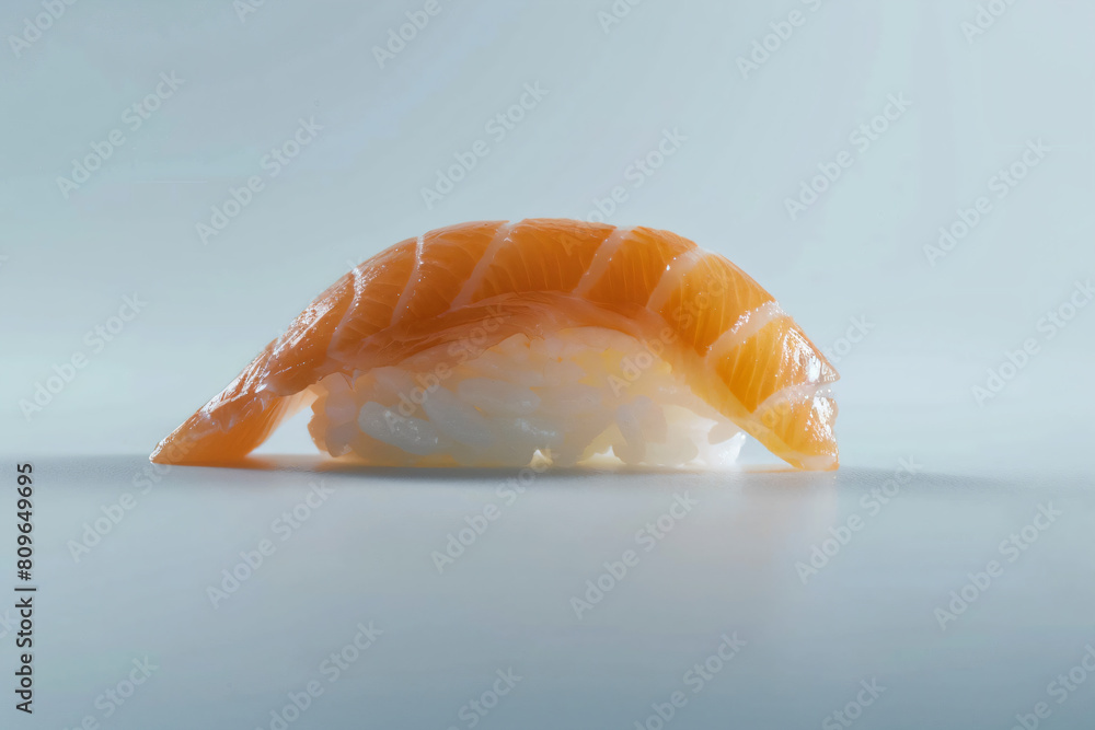 a piece of sushi sitting on top of a table a piece of sushi sitting on top of a table