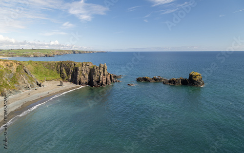 Sea stacks and sea arches on the Copper Coast, County Waterford, Ireland photo