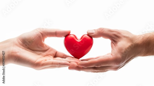 An image of a red heart in a woman s hand and in a man s hand. Concept of love  giving gifts  and donating.