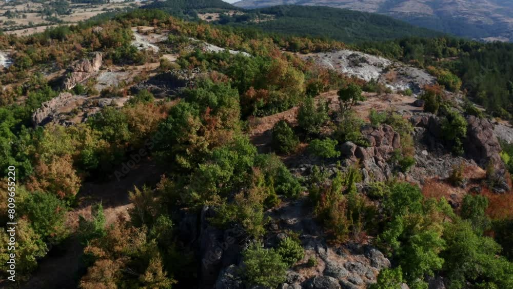Historic Thracian Sanctuary With Dense Forest In Harman Kaya, Rhodope Mountain, Bulgaria. - aerial shot Historic Thracian Sanctuary With Dense Forest In Harman Kaya, Rhodope Mountain, Bulgaria. - aerial shot