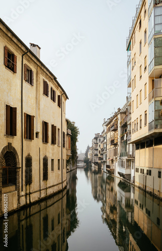The city canal San Massimo in Padua. Beautiful urban view of residential buildings with balconies in the center of the old city Padova, Veneto. Rivers Brenta and Bacchiglione, Italy photo