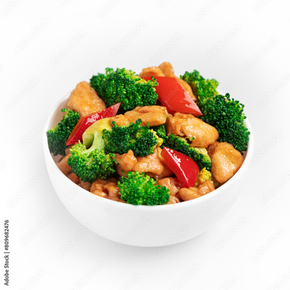Broccoli, paprika and chicken stir fry, Chinese cuisine on a white background, isolate Broccoli, paprika and chicken stir fry, Chinese cuisine on a white background, isolate