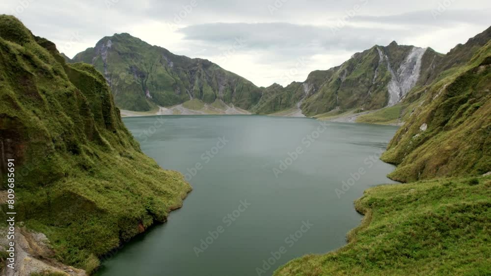 Tranquil Waters: Aerial Glimpse of Lake Amidst Mountain Majesty