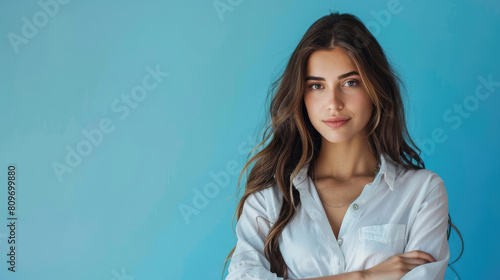 A captivating portrait of a young woman model with a sincere and natural smile. Isolated plain background. © Sabein