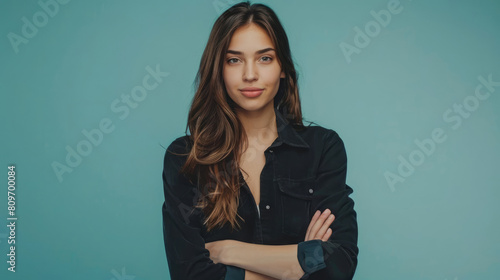The natural charm of a young beautiful woman model in a joyful pose. Isolater blue background.