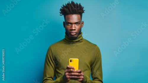 Man with Smartphone on Blue photo