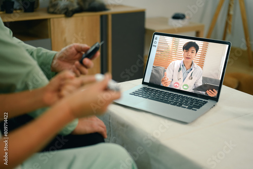 Senior couple having online consultation with doctor on laptop. Telehealth concept