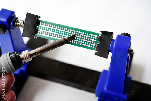 A printed circuit board for trace elements. Radio electronics. A holder for printed circuit boards.