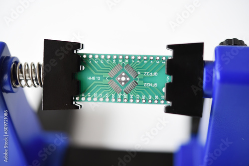 A printed circuit board for trace elements. Radio electronics. A holder for printed circuit boards.