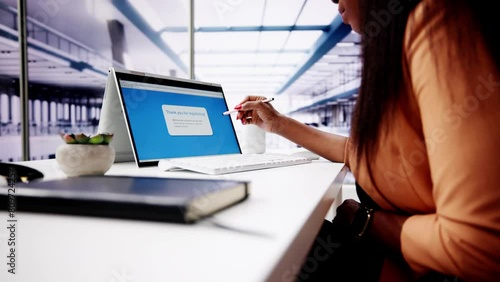 Businesswoman's Hand Filing Online Registration Form photo