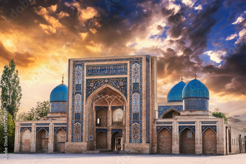 ancient old Muslim Madrasah of Barak Khan at sunset in summer. Hazrati Imam Architectural Complex in Tashkent in Uzbekistan photo