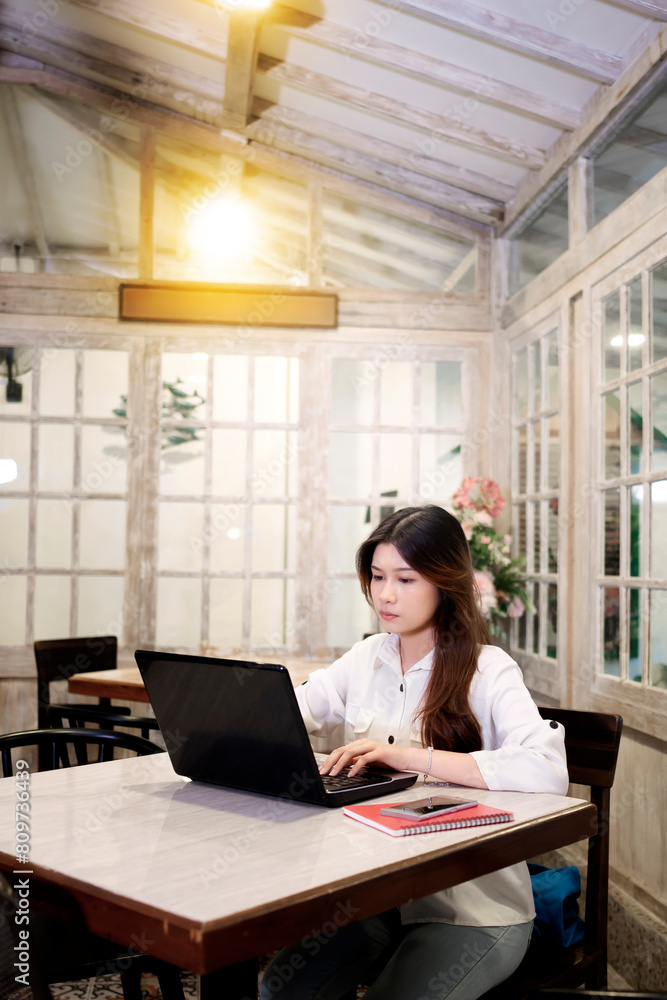 Portrait of a businesswoman using her laptop while working Portrait of a businesswoman using her laptop while working