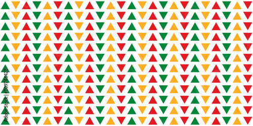 Seamless pattern with red, yellow and green triangles neatly aligned in columns on a transparent background. A simple solid pattern for wrapping paper, pillows, etc. Vector illustration
