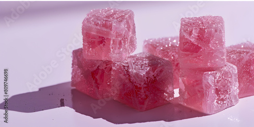 Closeup side view of four, cube shaped pink gummies, advertising product shot, in a pile, lit perfectly, fancy product shot, white background. (ID: 809746698)