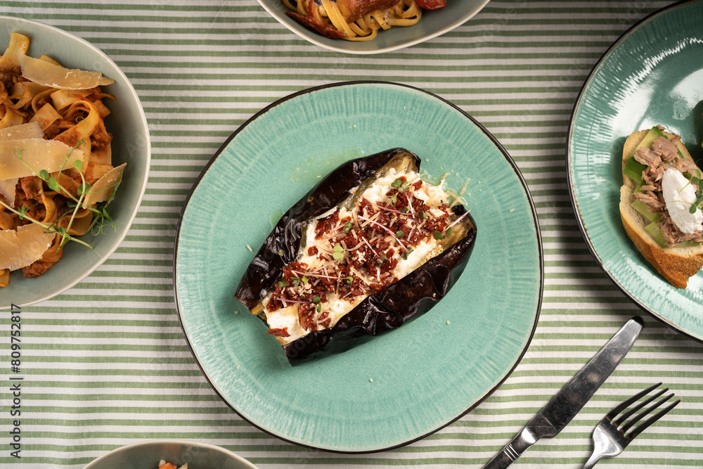 Baked eggplant with mozzarella cheese. Vegetarian food recipe concept Baked eggplant with mozzarella cheese. Vegetarian food recipe concept