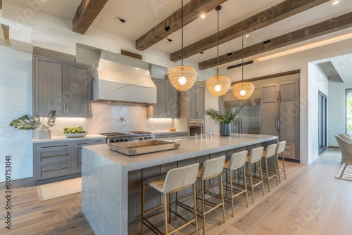 A spacious kitchen with a central island surrounded by chairs  featuring sleek gray wooden cabinetry and exposed SKcJ