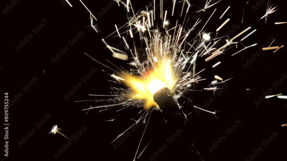 Lighted fire sparkler in the dark background Lighted fire sparkler in the dark background