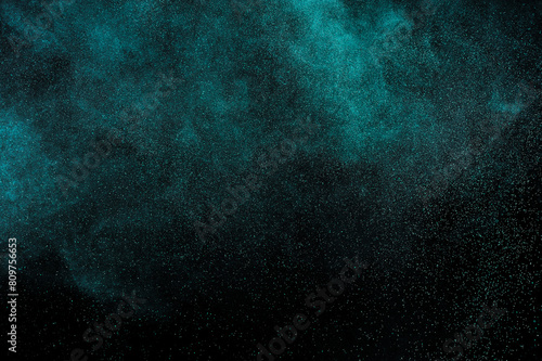 Aquamarine smoke cloud on black background. Light texture on dark sky. Space backdrop. Explosion pattern.