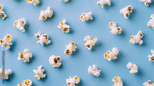 Minimalist layout of spinning popcorn kernels in a minimalist pattern