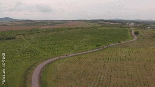 sports car driving down the road, drone footage