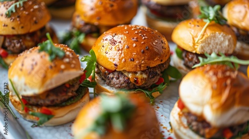 Rotating plate of gourmet sliders in a top-down perspective