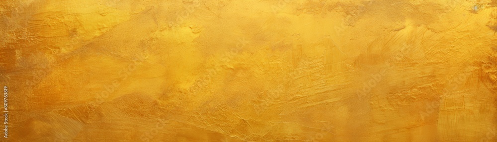 A photo of a gold-colored wall with a rough texture. ,background
