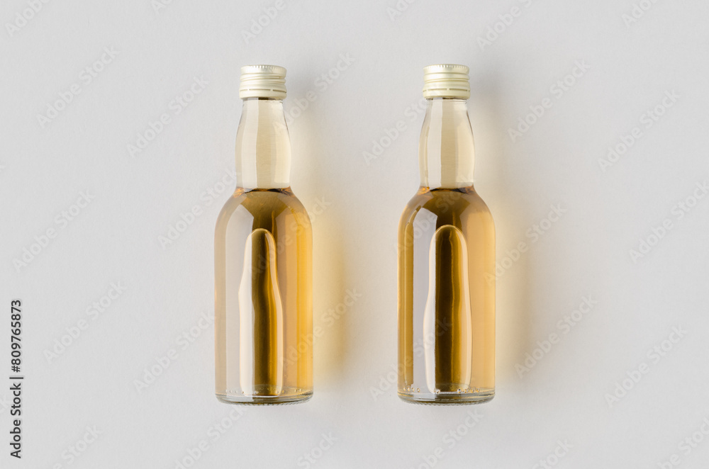 Fototapeta premium Miniature spirits, liquor bottle mockup.