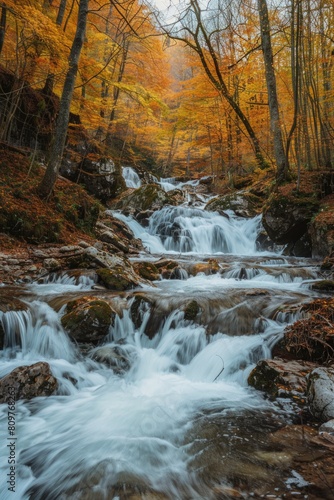 A beautiful waterfall with a stream of water flowing down it