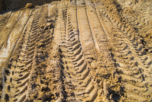 Excavator wheel tracks in a sand quarry