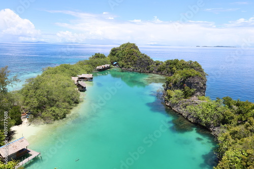 Aerial view of Rufas island with its lagoon in the middle located in Raja Ampat, West Papua photo