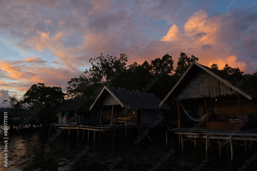 View of typical bamboo houses in West Papua, Raja Ampat archipelago View of typical bamboo houses in West Papua, Raja Ampat archipelago