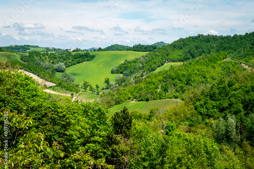 springtime panorama of the hills of oltrepo pavese, vinery area in italy (lombardy region) at the borders with piedmont and emilia romagna. it's famous for valuables wines, mainly sparkling wines.