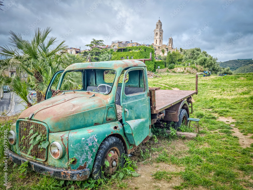Abandoned car in the ghost town of Bussana Vecchia, Italy Abandoned car in the ghost town of Bussana Vecchia, Italy