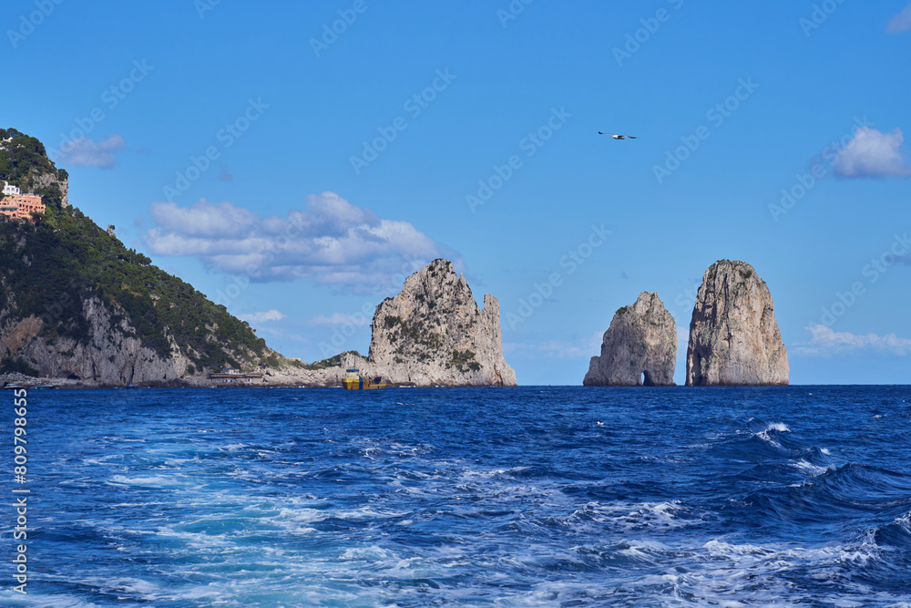 Naklejka premium Faraglioni di Capri, rock formations by the island of Capri in the Campanian Archipelago, Italy 