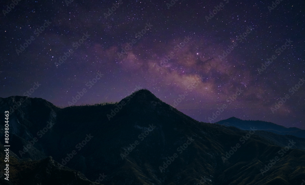 Landscape with Milky Way. Night sky with stars on the mountain,
