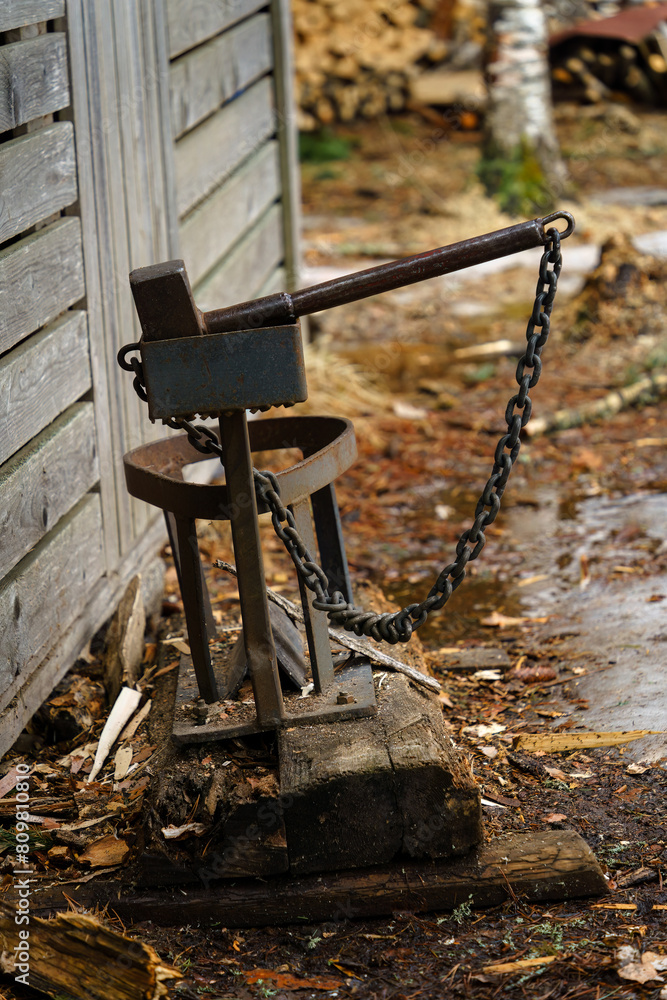 Homemade kindling splitter next to a shed in Finland. Homemade kindling splitter next to a shed in Finland.
