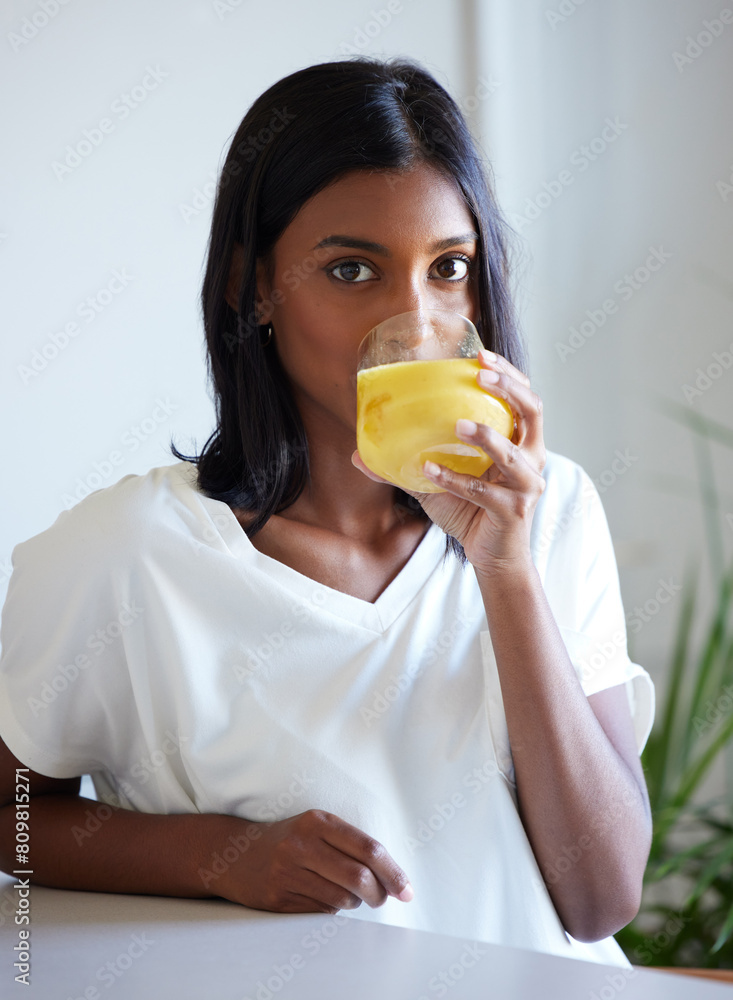 Portrait, home and Indian woman with juice, drink and nutrition to enjoy, healthy and apartment of girl. House, person and model with glass of natural liquid, morning and beverage for vitamin c Portrait, home and Indian woman with juice, drink and nutrition to enjoy, healthy and apartment of girl. House, person and model with glass of natural liquid, morning and beverage for vitamin c