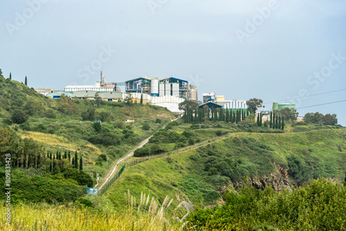 Industrial plant in green hilly area, Cantabria Spain photo