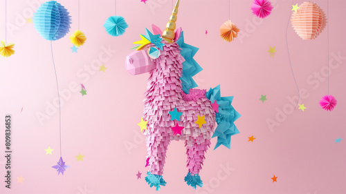 Pink unicorn pinata hanging from string