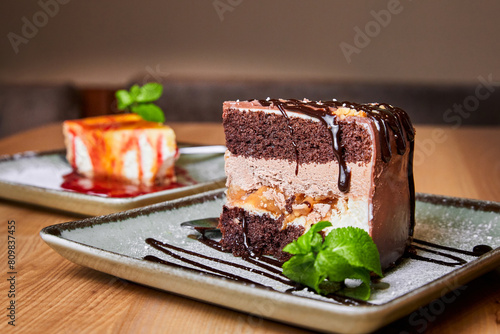 Piece of Snickers cake with peanuts, chocolate and caramel