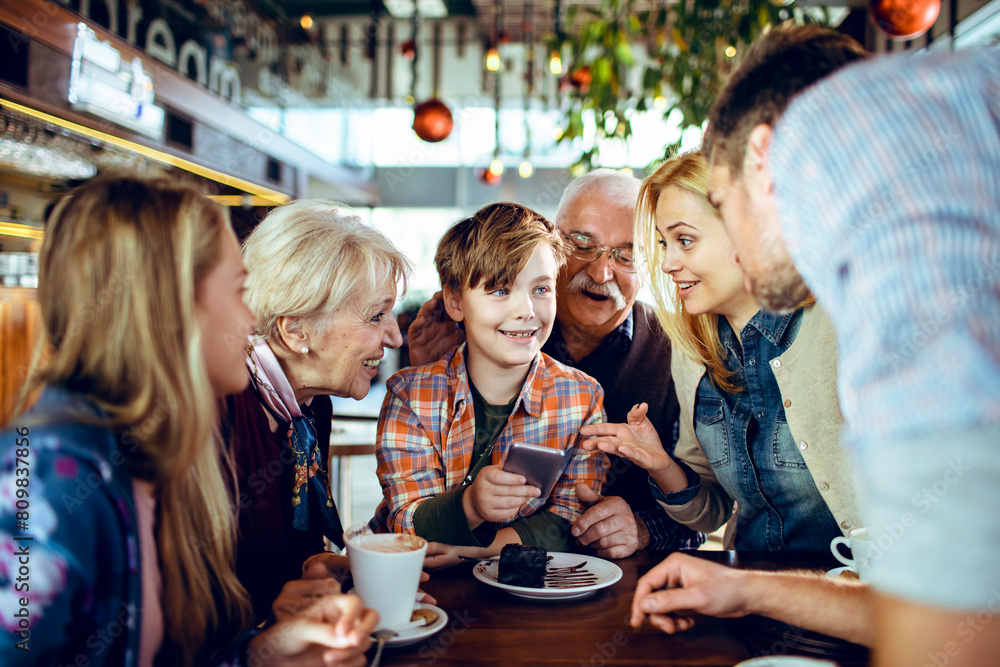 Family enjoying time together at a cafe during Christmas Family enjoying time together at a cafe during Christmas