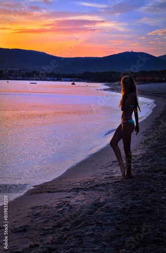 Beautiful Woman on the beach at sunset