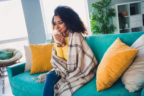 Photo of dreamy pretty girl sitting on sofa drinking coffee enjoying free time vacation cozy atmosphere indoors #809851690