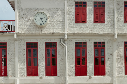 Architecture exterior view of Chinese style building with Round white watch face. Concept and design front of Chinese retro style, Space for text, Selective focus.