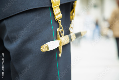  officer with a dagger on his belt . close up view