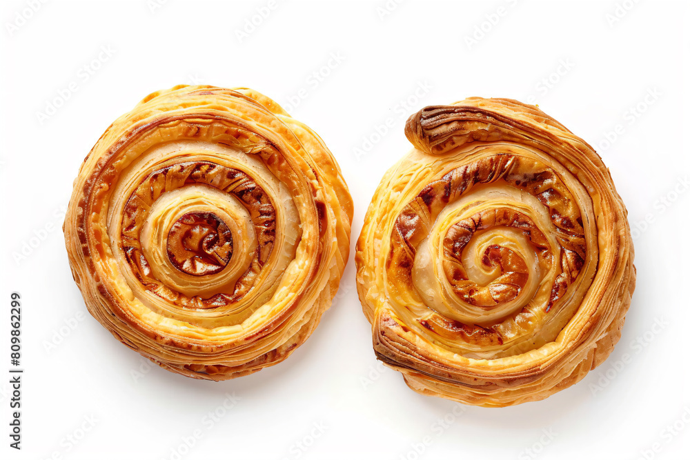 Fototapeta premium two pieces of pastry on a white surface