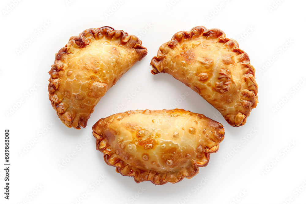 a couple of pastries sitting on top of a white surface a couple of pastries sitting on top of a white surface